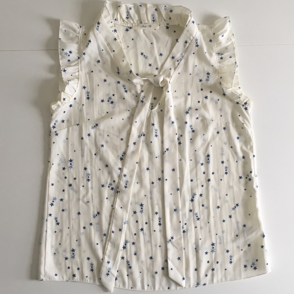 Sleeveless, tie-neck blouse with star pattern